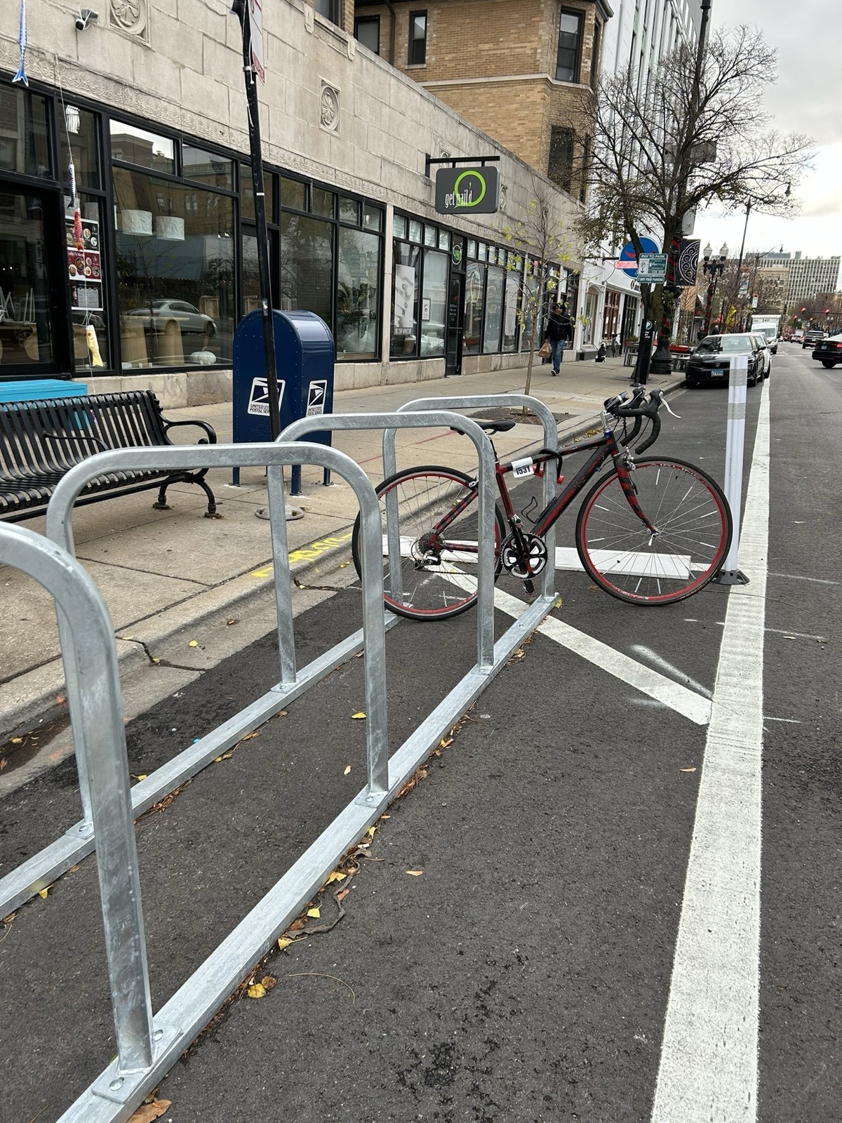 Bike corral and daylighting treatment next to a bikeway