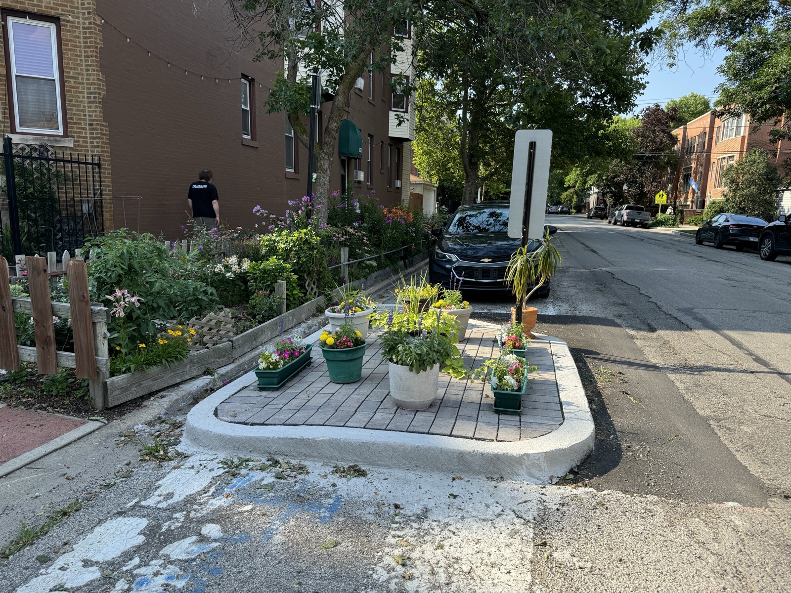 Planted curb extension narrowing the corner curb radius